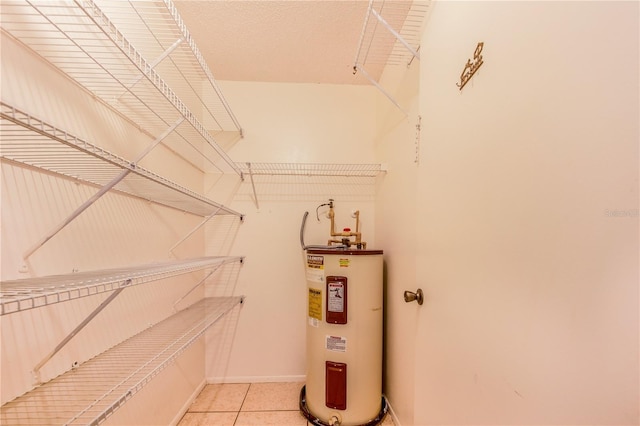 151 Winter Ridge Dr Unit 151, Winter Haven, FL 33881 - walk in closet with water heater and light tile patterned flooring