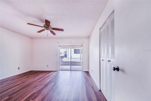 151 Winter Ridge Dr Unit 151, Winter Haven, FL 33881 - unfurnished room featuring baseboards, a ceiling fan, a textured ceiling, and wood finished floors