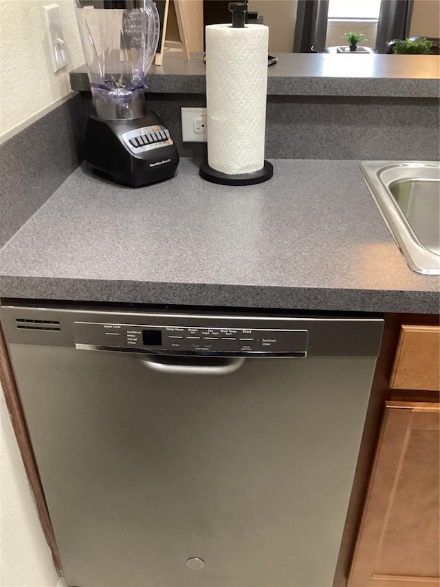 interior details featuring a sink and dishwasher