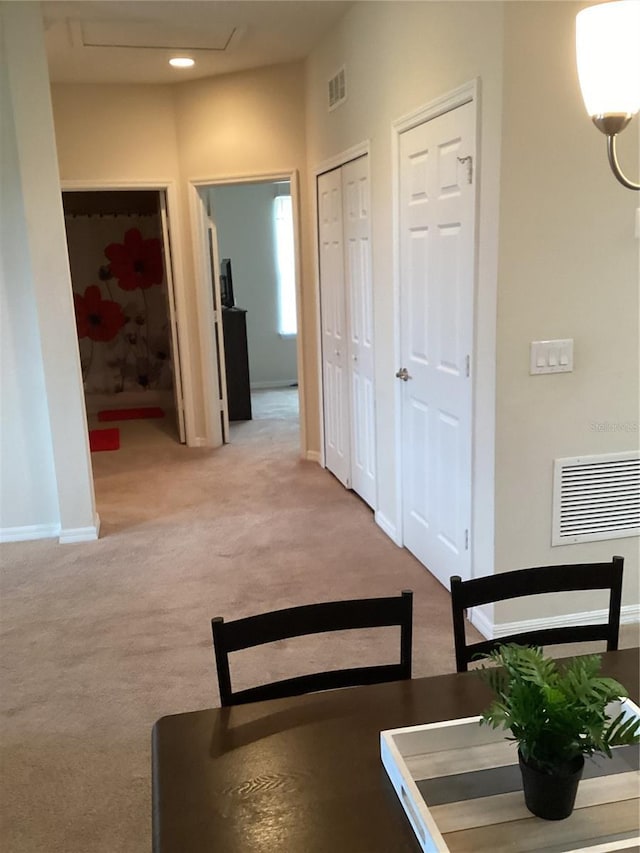 carpeted dining area with recessed lighting, baseboards, and visible vents