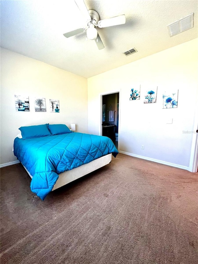 carpeted bedroom featuring baseboards, a ceiling fan, and visible vents