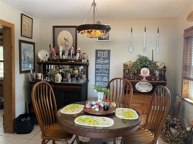 124 Palm Pl, Haines City, FL 33844 - dining room featuring tile patterned flooring and a dry bar
