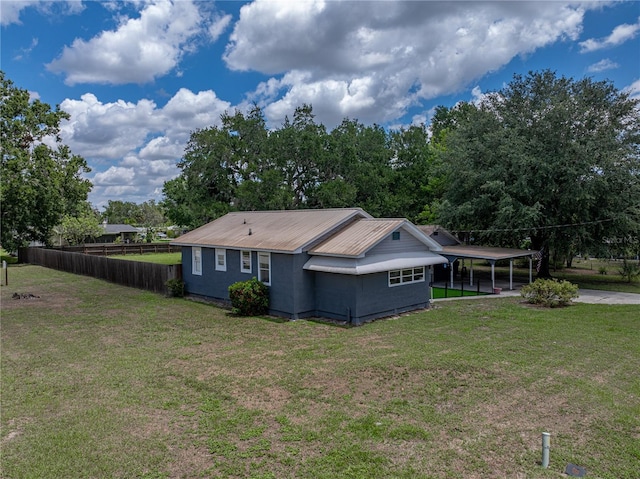 803 7th St NE, Fort Meade, FL 33841 - back of house with a carport and driveway