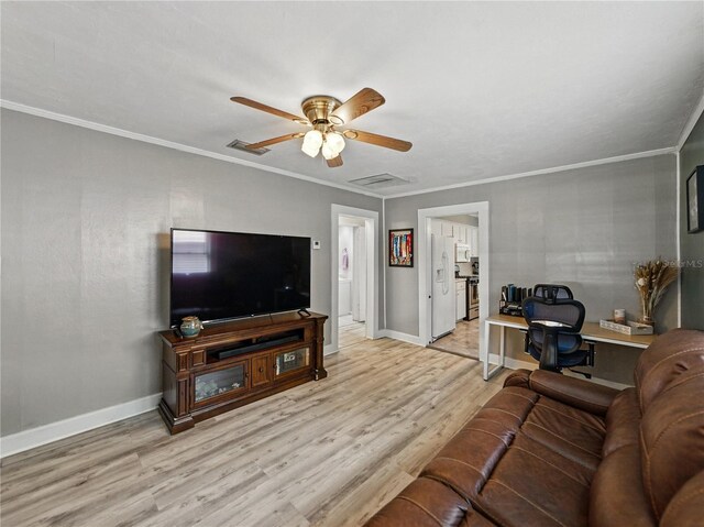 803 7th St NE, Fort Meade, FL 33841 - living room featuring wood finished floors, baseboards, crown molding, and a ceiling fan