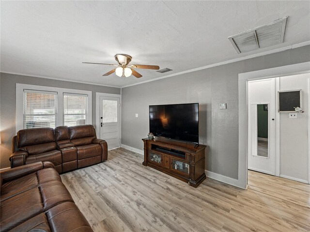 803 7th St NE, Fort Meade, FL 33841 - living area with ornamental molding, wood finished floors, baseboards, and ceiling fan