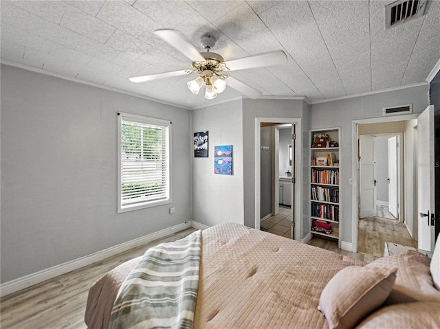 803 7th St NE, Fort Meade, FL 33841 - bedroom with light wood finished floors, ceiling fan, and baseboards