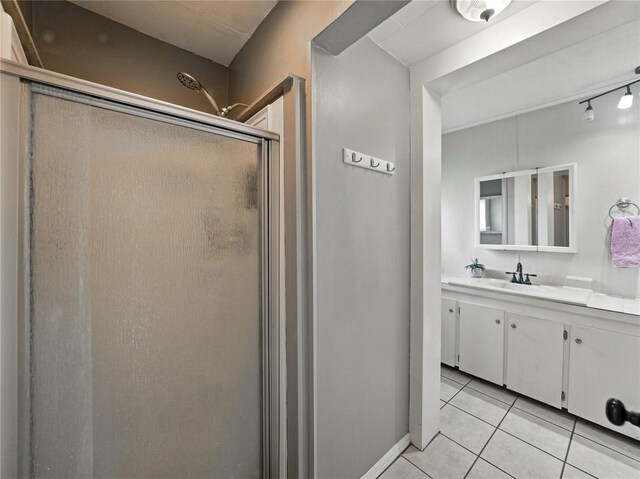 803 7th St NE, Fort Meade, FL 33841 - bathroom featuring a shower stall, vanity, and tile patterned floors