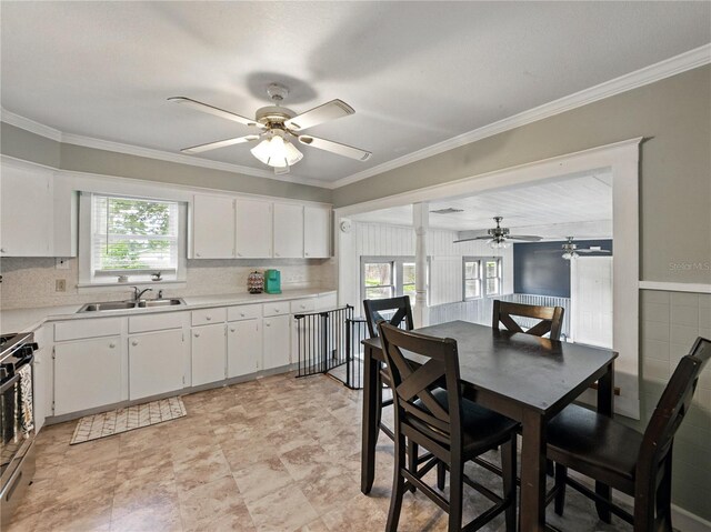 803 7th St NE, Fort Meade, FL 33841 - dining room with a ceiling fan and crown molding