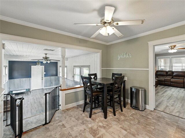 803 7th St NE, Fort Meade, FL 33841 - dining area with a ceiling fan, crown molding, and a wainscoted wall