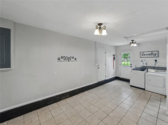 803 7th St NE, Fort Meade, FL 33841 - kitchen with washer and dryer, electric panel, light tile patterned floors, baseboards, and a chandelier