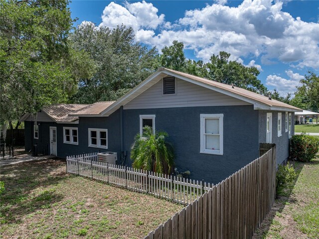803 7th St NE, Fort Meade, FL 33841 - back of house featuring central air condition unit