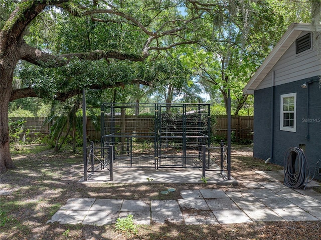 803 7th St NE, Fort Meade, FL 33841 - fenced backyard with an exterior structure and an outbuilding