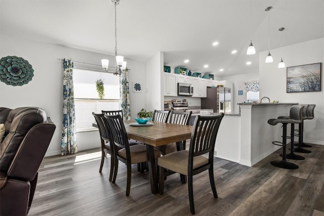 dining area with recessed lighting, baseboards, a chandelier, and dark wood-style floors