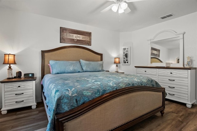 bedroom featuring visible vents, ceiling fan, and wood finished floors