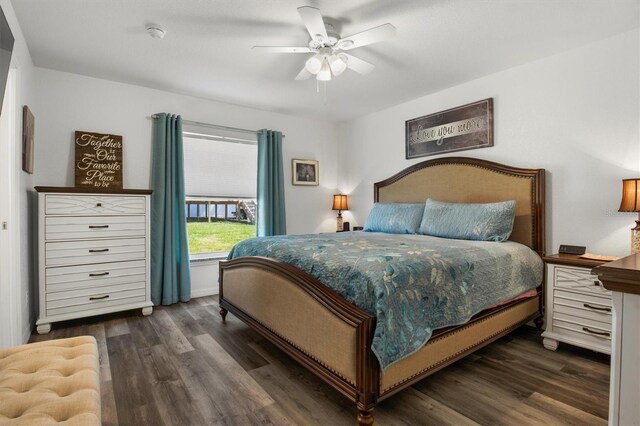 bedroom featuring a ceiling fan and dark wood-style floors