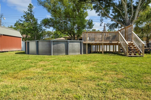 view of yard with a wooden deck and stairway