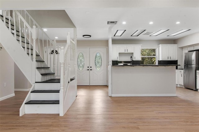 6317 Discovery Ln, Land O Lakes, FL 34638 - interior space with light wood-style floors, recessed lighting, stairs, and visible vents