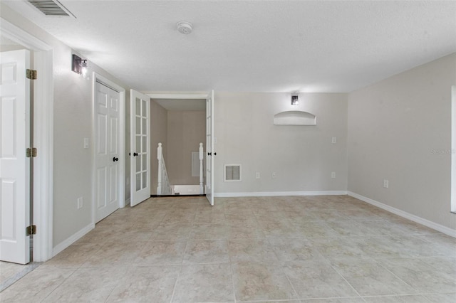 6317 Discovery Ln, Land O Lakes, FL 34638 - empty room featuring visible vents, a textured ceiling, and baseboards
