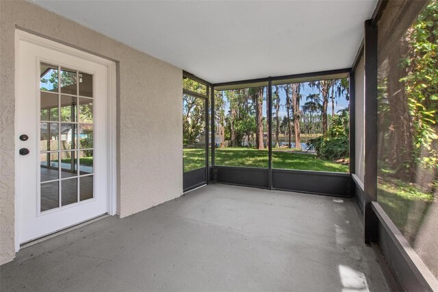 6317 Discovery Ln, Land O Lakes, FL 34638 - unfurnished sunroom with a water view