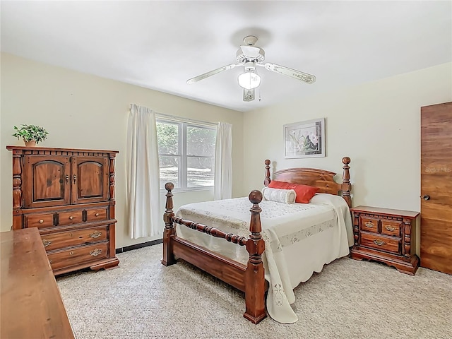 bedroom featuring ceiling fan and light colored carpet