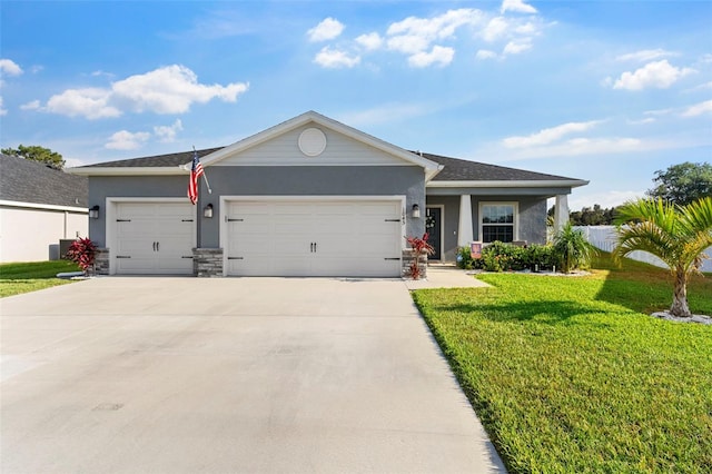 view of front of house with driveway, a front lawn, an attached garage, stone siding, and stucco siding