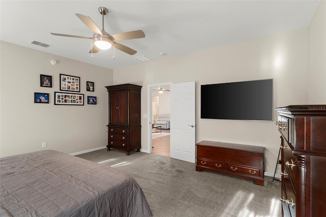 bedroom featuring visible vents, carpet, and baseboards