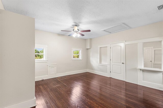 unfurnished room featuring baseboards, a textured ceiling, ceiling fan, and wood finished floors