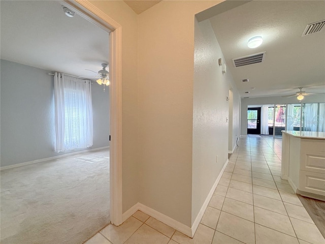 4480 Turnberry Ln, Lake Wales, FL 33859 - corridor featuring light tile patterned flooring, baseboards, and visible vents