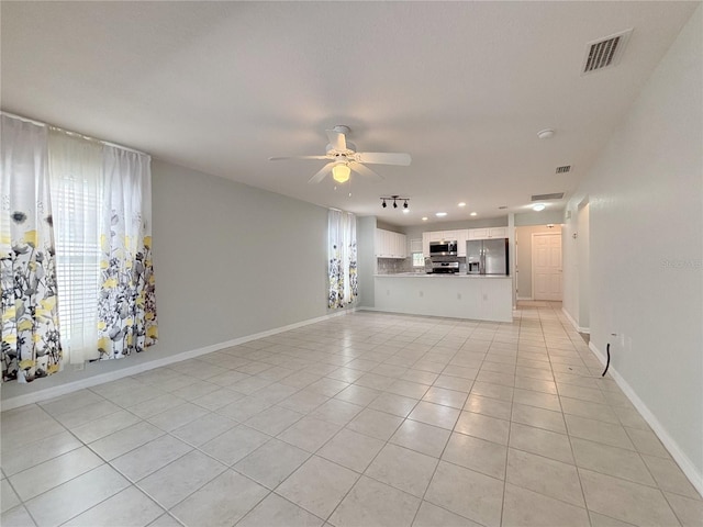 4480 Turnberry Ln, Lake Wales, FL 33859 - unfurnished living room featuring ceiling fan, visible vents, light tile patterned floors, baseboards, and recessed lighting