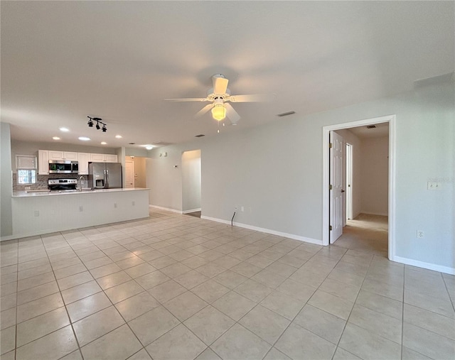 4480 Turnberry Ln, Lake Wales, FL 33859 - unfurnished living room featuring recessed lighting, baseboards, ceiling fan, and light tile patterned floors