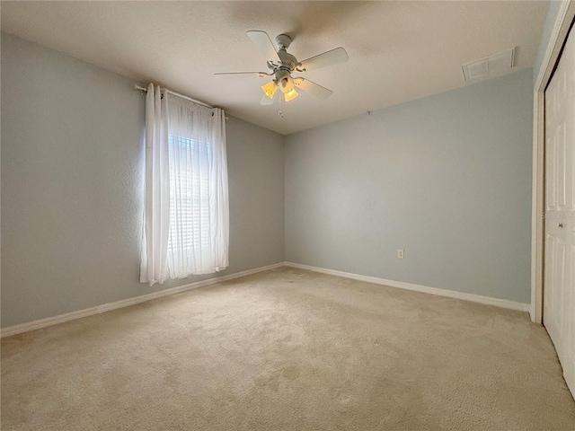 4480 Turnberry Ln, Lake Wales, FL 33859 - empty room with carpet flooring, a ceiling fan, baseboards, and visible vents
