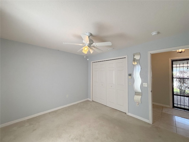 4480 Turnberry Ln, Lake Wales, FL 33859 - unfurnished bedroom with a ceiling fan, baseboards, light carpet, and a closet