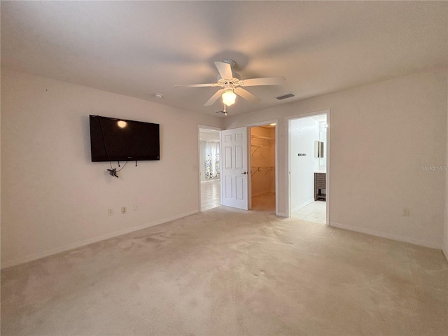 4480 Turnberry Ln, Lake Wales, FL 33859 - interior space featuring visible vents, a closet, baseboards, a walk in closet, and light colored carpet