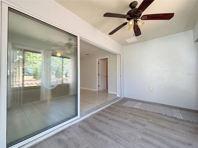 4480 Turnberry Ln, Lake Wales, FL 33859 - empty room featuring baseboards, ceiling fan, wood finished floors, and visible vents
