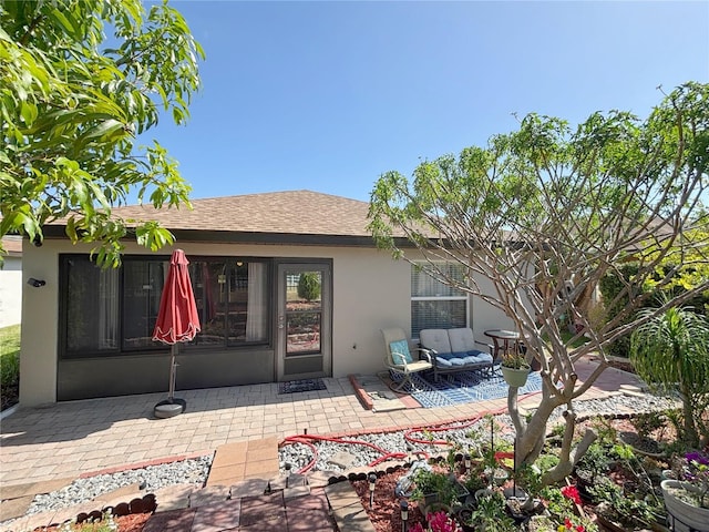 4480 Turnberry Ln, Lake Wales, FL 33859 - rear view of property with a shingled roof, a patio, and stucco siding