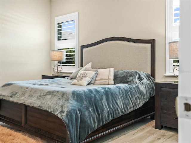 bedroom with wood finished floors