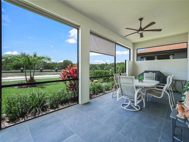 sunroom / solarium with tile patterned floors