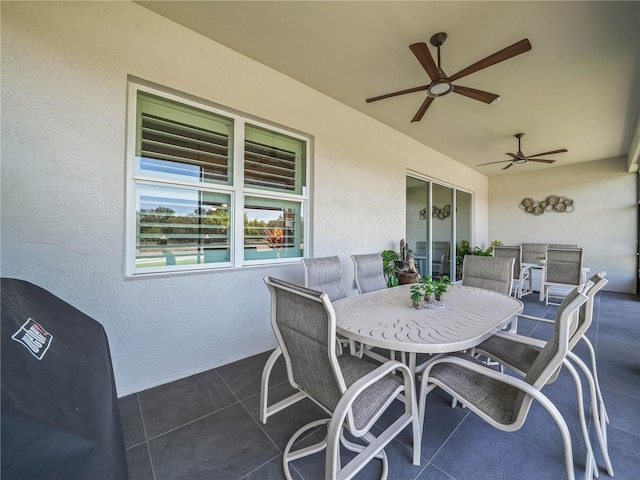 view of patio / terrace with outdoor dining area and ceiling fan