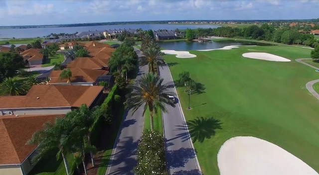 bird's eye view featuring a water view and golf course view