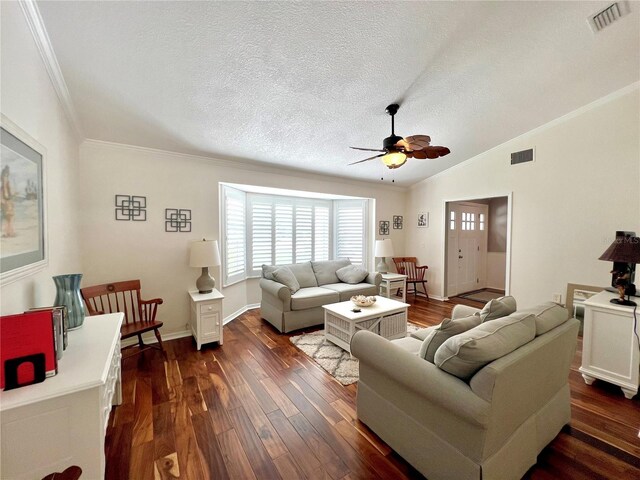living area featuring crown molding, ceiling fan, dark wood-type flooring, and visible vents
