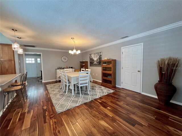dining space with an inviting chandelier, dark wood-style flooring, a textured ceiling, and visible vents