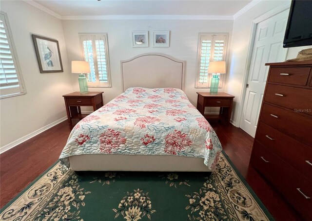 bedroom featuring ornamental molding, multiple windows, and dark wood finished floors