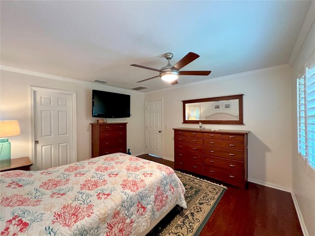 bedroom with baseboards, ornamental molding, dark wood-style flooring, and visible vents