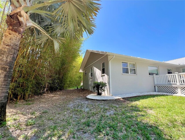 view of side of property featuring stucco siding
