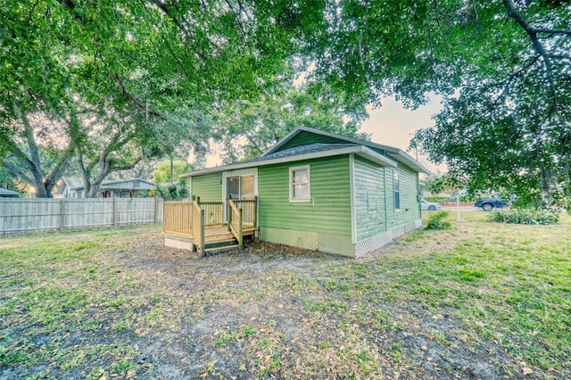 230 Denton Ave, Auburndale, FL 33823 - rear view of house with fence and a deck