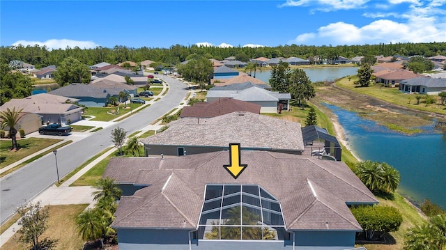aerial view of residential area with a large body of water