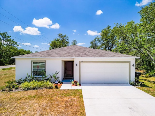 single story home with a garage, stucco siding, driveway, and a front yard
