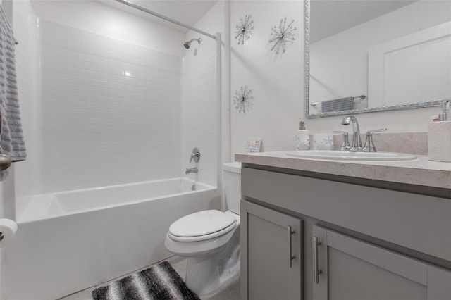 bathroom with toilet, shower / bathing tub combination, and vanity