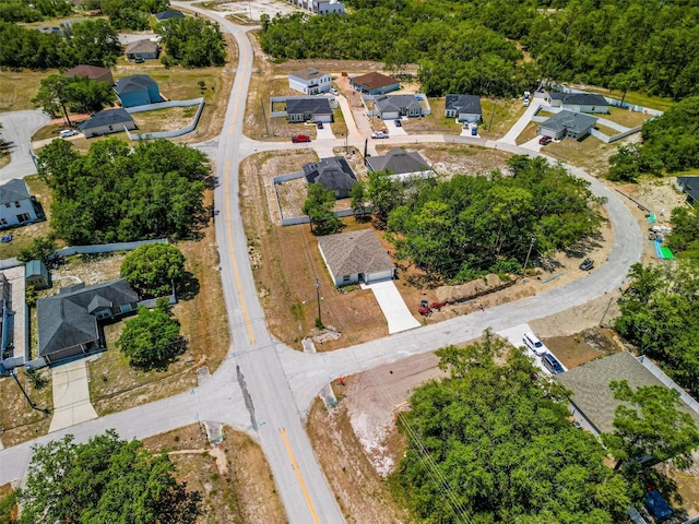 birds eye view of property with a residential view