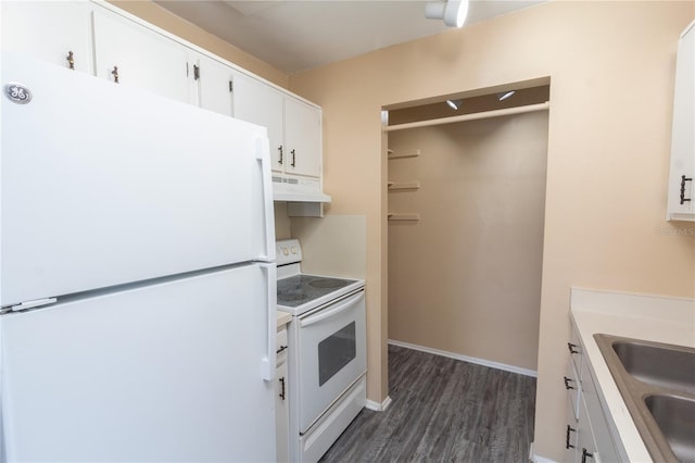 kitchen featuring a sink, white appliances, white cabinetry, dark wood-type flooring, and under cabinet range hood